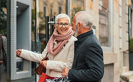 Couple at an atm.